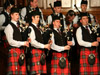 In Concert at the Guildhall in Derry, 2009. Drummers: Earl Glasgow, Geoff Wilson, Gareth McLees and D/S Keith Orr. Pipers: P/S Alastair Dunn, Jonathan Greenlees, Stuart Irvine and Matt Wilson