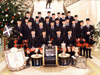 The 2011 FMM Pipe Corps, posed with 'the big five' at Stormont