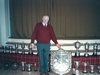 Billy Maxwell, the band's first pipe major and the current band president, with the season's trophies in 1990