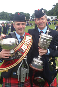 Pipe Major Richard Parkes MBE and Drum Sergeant Keith Orr bring home the silverware for FMM