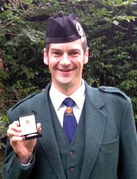 Jonathan Greenlees with the Braemar Gold Medal